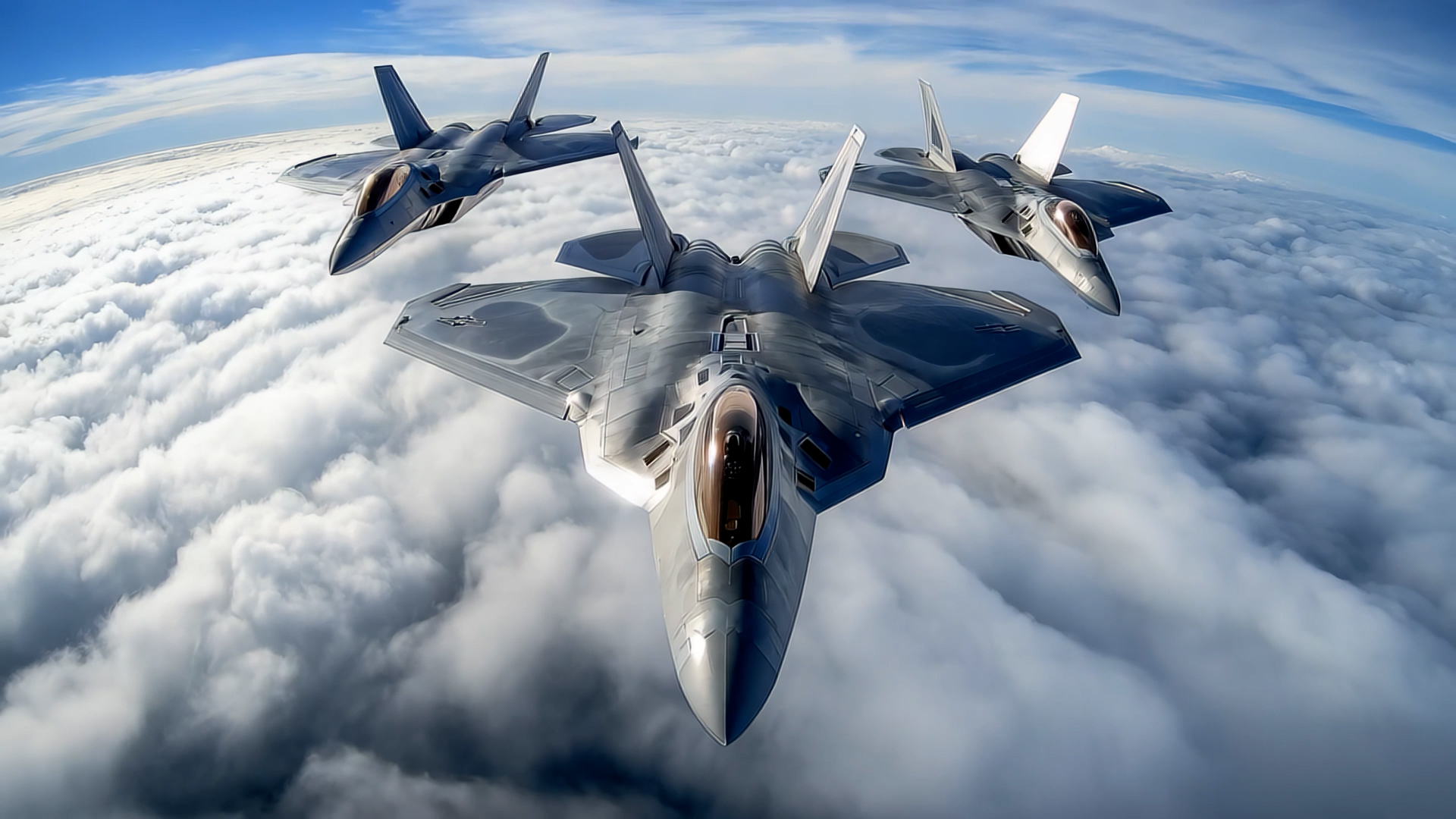 3 fighter jets in formation over top of clouds